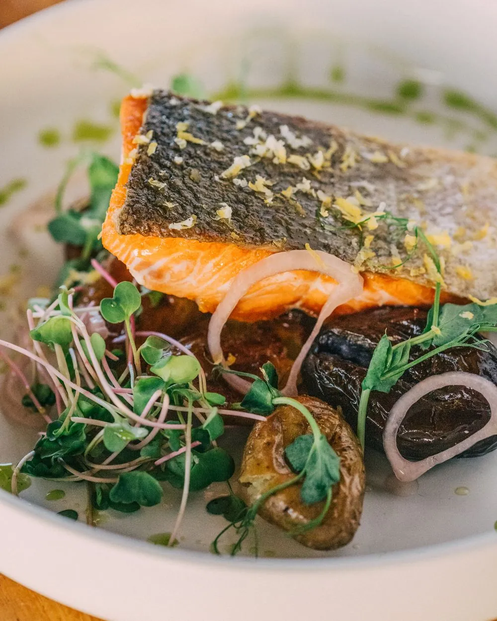Crispy skin salmon with roasted potatoes and microgreens